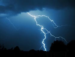 Artificial triggering of lightning strokes in a storm