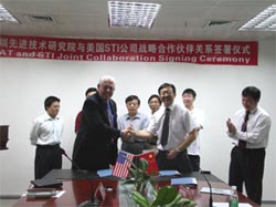 SIAT Director-general FAN Jianping and President of STI Nicholas J. Susner sign an agreement for cooperation.